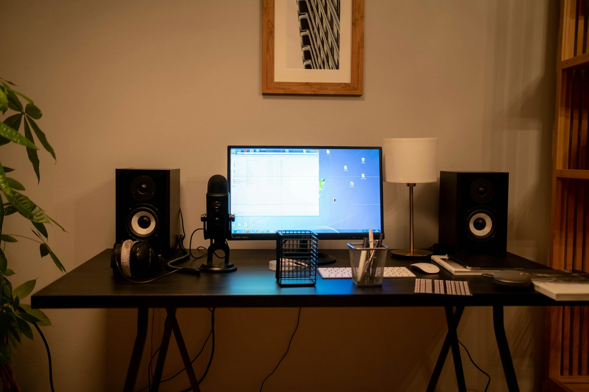 A well-organized modern home office desktop setup featuring technology essentials and accessories.